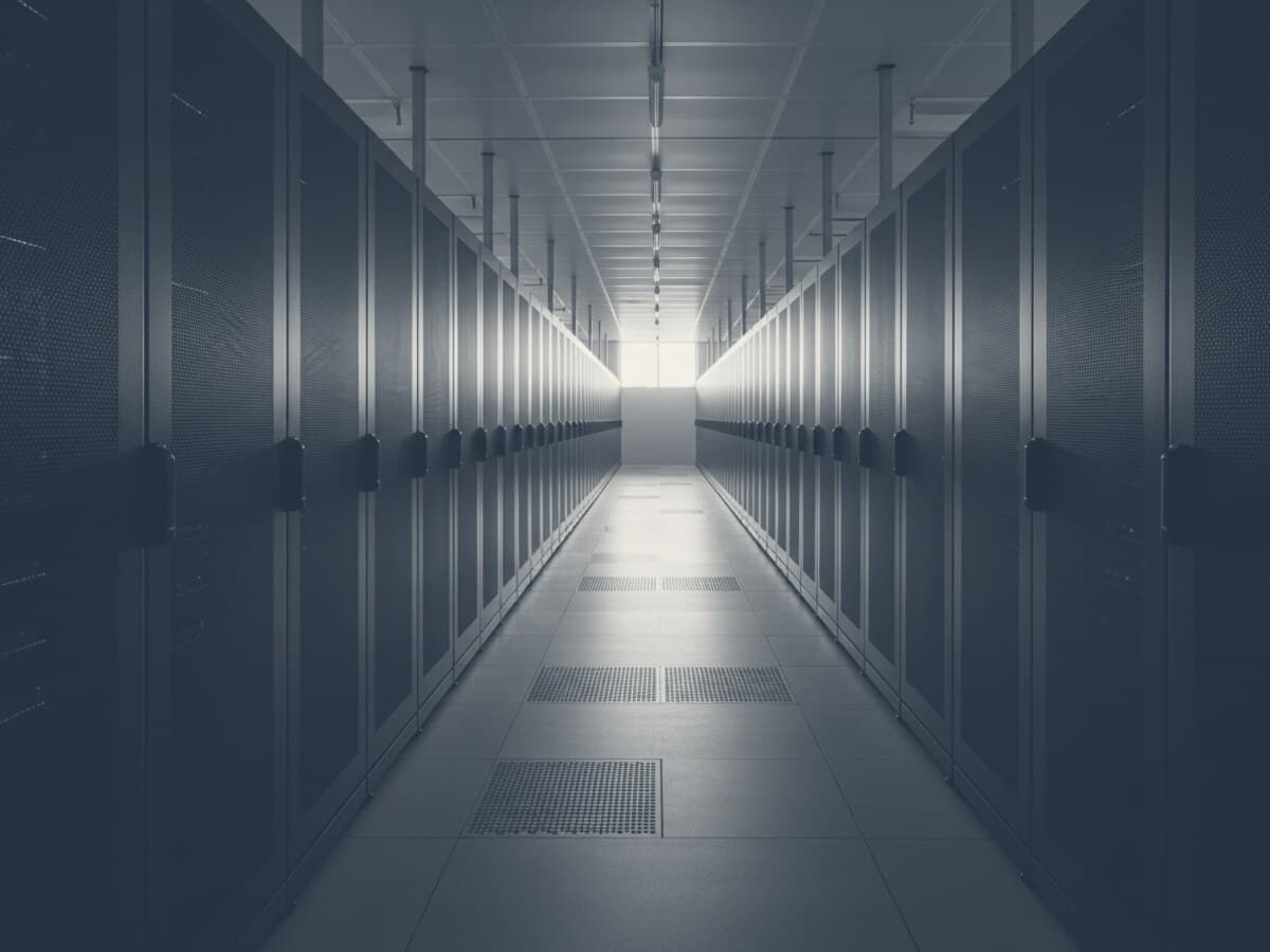 Duotone graphic of server racks in a data hall.
